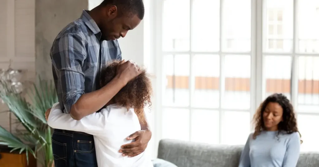 Father hugs daughter