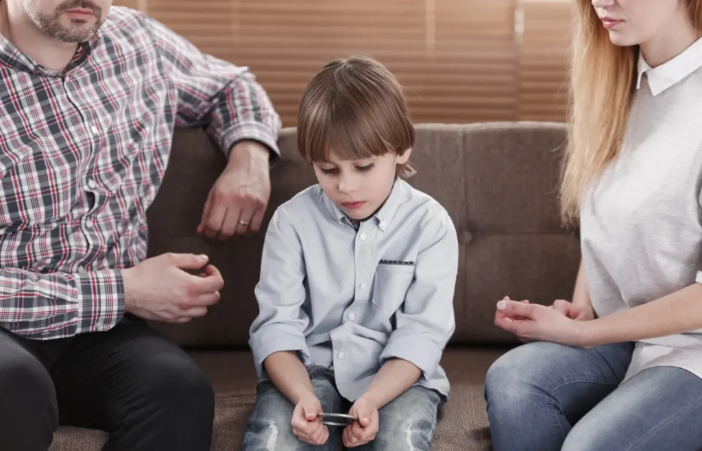child being visited by parents